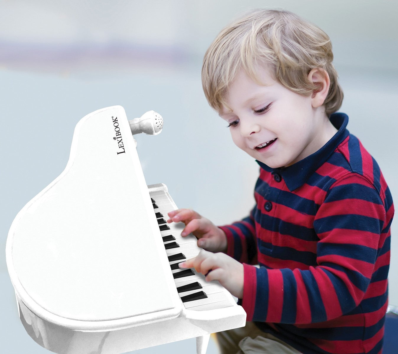 Elektronisches Mini-Klavier mit Füßen und Mikrofon